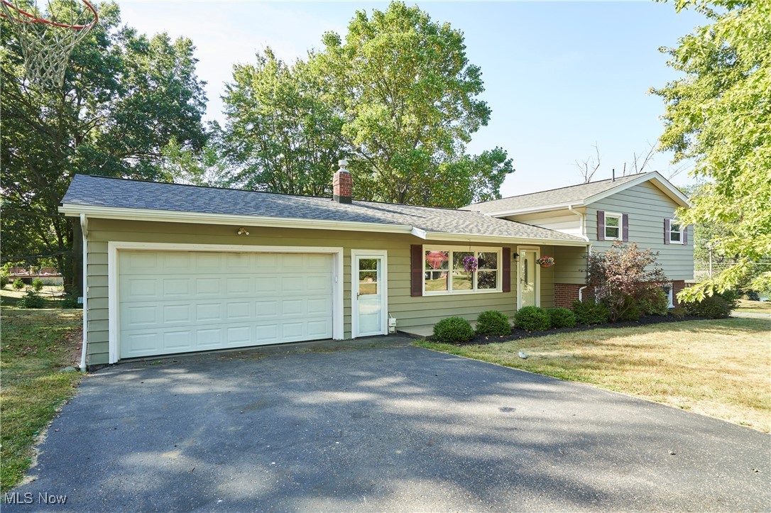 Welcome to the sought-after Lake Harmony community, where every day feels like a vacation. This vibrant neighborhood is centered around a scenic 30-acre private lake that offers 2 sandy beaches, pavilions, a boat dock, & plenty of opportunities for swimming, fishing, jet skiing, & tubing. Whether you’re enjoying a peaceful evening stroll along the quiet streets or entertaining by the water, Lake Harmony offers the lifestyle you’ve been searching for. This spacious 4-BDRM 2-BTH home is perfectly situated on a beautiful lot w/water views & a floor plan. The main level features a large living RM w/vaulted ceiling & abundant natural light, seamlessly connected to the dining RM & kitchen. A cozy LL family RM showcases a FP w/a refreshed facade & direct access to the back patio—ideal for relaxing & taking in calming views of the lake. 3 BDRMS are located upstairs, while a private BDRM on the LL offers flexibility for guests, home office, or multigenerational living. The oversized 2-car garage & unfinished BSMT provide ample storage space. The home has been thoughtfully maintained & updated w/modern conveniences, including a new roof (2025), sump pump (2023), & submersible well pump (2023). Recent interior improvements include freshly repainted bathrooms (2020), kitchen (2025), & family RM (2025), along w/2wo new doors (2025) & a new window facing the front yard (2025). Add'l upgrades feature tamper-resistant outlets, select smart switches compatible w/Amazon Alexa, & fiber internet installation through MCTV. The LL was updated with lighting, while the garage includes a newer opener (2019), remote-controlled lighting, & added BSMT lights for convenience. Exterior highlights include refreshed landscaping & new light fixtures at the front door & back patio (2025). With its balance of recent upgrades, generous space, & unmatched lake amenities, this property offers a rare opportunity to enjoy a true lake-life lifestyle in a welcoming & friendly community.