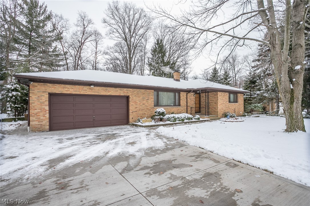 This sprawling home is nestled on over 1 acre and awaits its new family! Solid Brick Ranch with 2,084 Sq.Ft of above ground living space. This home features 3 bedrooms, 2.5 baths, 2 car garage and a partially finished basement. Upon entry you are greeted with an open foyer that seamlessly leads into the gracious living area beaming with an abundance of natural light through the large windows. Adjacent from the living room is the the formal dining room with built in glass showcase & cabinets. The eat-in kitchen offers all appliances, breakfast bar, ample cabinet storage and ceramic flooring. You are greeted by voluminous ceilings in the family room featuring a beautiful brick fireplace wall, ceiling fan, skylight, Pella windows & sliding door that opens to an inviting covered patio & wooded 1 acre yard with a shed in the back. Three generous bedrooms with sizable closets & two full baths finish off the 1st floor living. The clean partially finished basement has a decorative fireplace, g