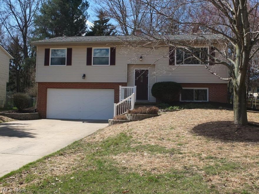 Remodeled 3 bedroom, 1.5 bath bi-level with open concept and updates throughout! Open concept living room and kitchen with dinette. Living room has picture window, crown molding and new carpet. Kitchen has tile flooring and backsplash, island with breakfast bar and dinette and comes applianced with stainless steel dishwasher, electric flat top range, oven and over the range microwave. Dinette has crown molding and slider to 25x12 screened in porch that leads to back deck. Full bath on main level has tile flooring, solid surface countertop and spacious linen closet. 3 good sized bedrooms complete the main level! Finished lower level offers a family room, half bath, plenty of storage and access to 2 car attached garage. Backyard offers screened in porch, large storage shed and deck, too! Come see all this home has to offer!