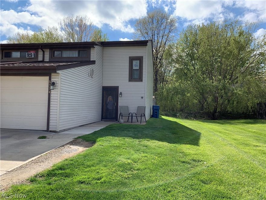 Check this one out!  Convenient First Floor FULL Bathroom, Laundry, and access to attached Garage.  Second floor has an extra large Main Bedroom, Two more bedrooms with large closets, and a full Bath. Many major updates completed:  Windows, Doors, Lighting, Closet & Interior Doors (1 exception), Flooring, Central Air & Heating, Hot Water Tank (80 gal.), Plumbing and Electrical.  Open-concept Living Room, Dining, and Kitchen (includes pantry).  All appliances stay EXCEPT Refrigerator and Fireplace.  Thru the sliding doors, you'll find a private, relaxing patio.  Located close to shopping, restaurants, and highways, yet a peaceful neighborhood.  North Ridgeville School District.  Home Warranty included.  Tastefully decorated and ready for you to move right in!