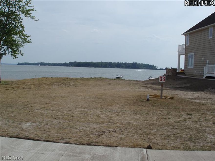 Beautiful Lakefront Lot** Lot#33 on the Bay. Your own sandy beach front property. Private gated Resort with Par 3 Golf Course, Clubhouse Pool & Fitness Center. 730 slip Marina, Picnic area. Awesome views of the Lake Erie, Sandusky Bay, Cedar Point.