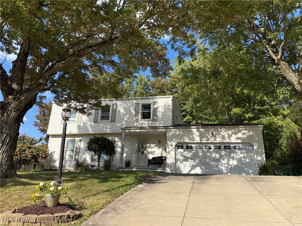 Welcome to this cozy 4 bedroom and 2.5 bathroom home in a quiet neighborhood in Fairlawn with over 2000 sq ft of living space and a fenced in backyard and an expansive 24ft x 16ft concrete Patio. Drive up to see the two car garage and extra spaces next to the garage. Walk up to the front porch and enter the foyer. Either step into the Family Room or turn left into the Living Room. At the back of the home you will find both the Kitchen and Dining Room which look out to the Backyard. The kitchen has stainless steel appliances including a new stove (2025). On this floor you will also find a half bath. Upstairs you will find 4 nice sized bedrooms with a primary bedroom with its own private full bathroom. The hall bathroom has been updated with a beautifully designed tub and shower area. The lower level provides flexible living space that can used as Family Room or what ever you decide. You will also find a great laundry area and plenty of storage. The back yard is completely fenced in and the Family Room provides a slider to access this area to entertain and enjoy. Additional highlights include a new roof, gutters, and siding in 2020.