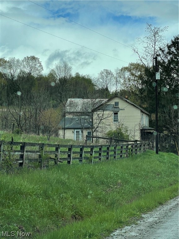 Selling Property to settle the estate. 2 story House, approximately 800 sf that has not been lived in for years and is tear down condition. 46 x 84 pole barn in good shape that would make nice barn for horses or farm equipment. .Numerous smaller out buildings. 4 acres on opposite side road that is level and neighbors creek.( This land has been farmed by neighbor for hay). Seller does not own mineral rights. Did have free gas to the house but gas well has not been producing. (house, hay barn, pole barn, older horse stalls and other small buildings on property).