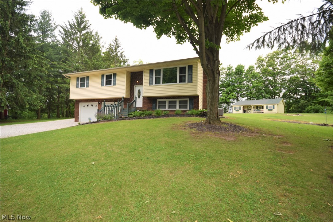 Welcome to 7696 Boneta Road in Wadsworth! You'll fall in love with this gorgeous 3 bedroom, 3 bathroom home that has numerous features throughout. Step into the kitchen and you'll immediately notice the premium kitchen flooring, stainless steel appliances, spacious counter tops & plentiful cabinets. The sliding glass doors off the dining room lead to a wooden deck overlooking the spacious backyard. The living room has a large window overlooking the front yard that allows so much bright, natural light into the home. The lower level offers MASSIVE 2 car garage with nature stone floors that enters into a mud space a bonus living room and updated full bathroom. You don't want to miss this!
Lot is actually 1.99 acres