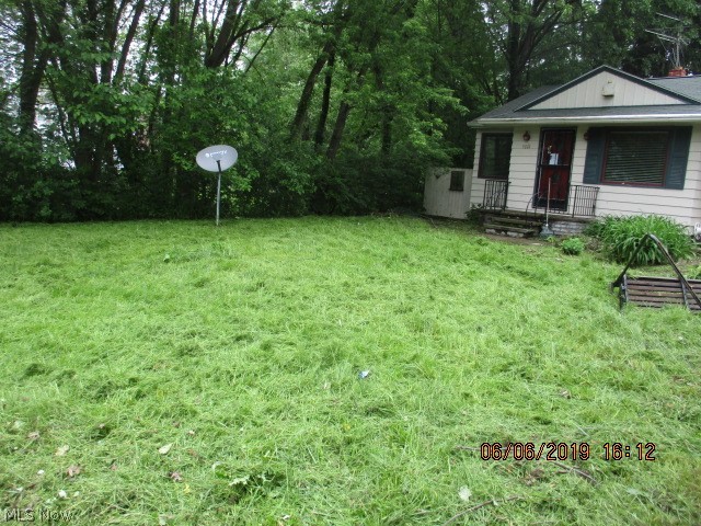 Cozy and affordable! Don't miss this 2 bedroom ranch home with attached garage. Located on a 75x200 lot, this home also includes the nearly one third acre lot behind it, for a total of well over half an acre! Plenty of room for an addition, outdoor entertaining and more! The unfinished basement would make a great play or hobby space, other rooms on the first floor offer hardwood flooring. Priced to sell!