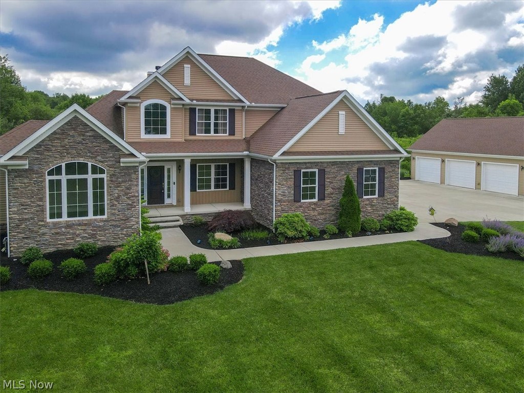 Nestled on a sprawling 9.5 acre lot, this charming colonial offers the perfect blend of country living and modern convenience. Situated in the Buckeye Local School District, this home is an ideal choice for families seeking a tranquil escape. As you step inside, you'll be greeted by an inviting foyer that leads to the heart of the home - a spacious living room featuring a stone fireplace. The open-concept design seamlessly flows into the ding area and kitchen boasting ample counter space and stainless-steel appliances. On the main floor, you'll find the luxurious primary suite featuring ensuite bathroom with his and her walk-in closets and soaking tub. The upstairs bedrooms share a full bath, offering plenty of space for growing families or guests. The basement features a full bath and two rooms that could be used as additional bedrooms, offices, plus large area that's perfect for a man cave or rec room. Step outside and you'll discover a true oasis-offering the perfect backdrop for outdoor adventures, gardening or simply enjoying the serenity of nature. The covered patio offers a great place to entertain or relax. And, don't forget the pool, built-in firepit and gazebo. If that isn't enough, there's also a 1500 sq. ft./3 car detached garage with second floor storage. Don't miss your chance to make this one-of-a-kind colonial your forever home.