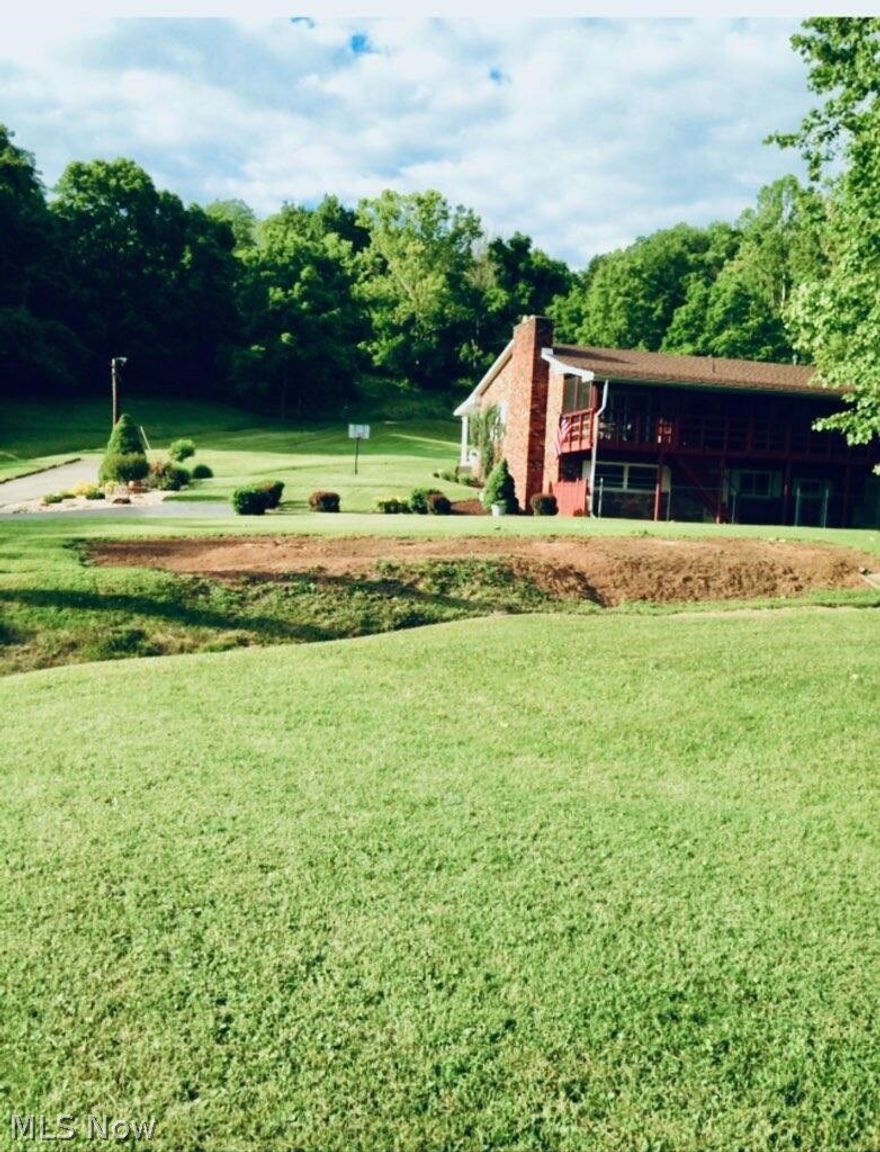 One of a kind...brick ranch that has never been on the market before. 28+/- acres with mineral rights. It also has an entrance off Pine St. Great for developers. Survey being done. PLUS a huge separate building that is a functioning workshop. Walk onto the covered front porch into the foyer which opens into the living room and through to the kitchen. The kitchen is open to the dining area with a fireplace and sliders that walk out onto a covered screen room full length of home with steps that go down to the patio. From the living room the hall leads to 3 bedrooms and a nice size bath. From the foyer you can go down to the lower level with it's rec room with fireplace, sliders to the patio with a fence that has a gate. There is a driveway set apart for this entrance separate from the main driveway. The rec room is open to a full kitchen. Lower level also has a bedroom and full bath. Plus a pantry, 3 storage areas, utility room-mudroom. Many updates: roof in 2024, kitchen 2019, Fridg 2023, Furnace 2013, windows 2015, Hot water tank 2020. Carper main floor 2-14. There are some old trails in the woods. Qualified buyers only please. Also a new school coming