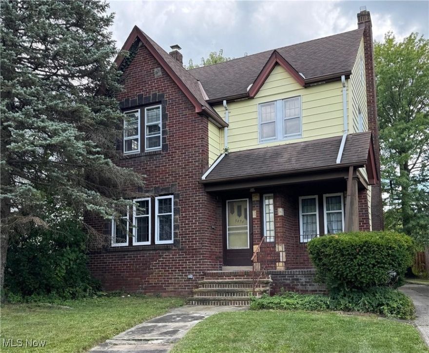 So much nostalgia in this 1929 Colonial from the appealing brick and vinyl exterior to the huge rooms flowing with warm hardwood flooring and trim through all 3 floors. The quaint French doors add a special charm as found in several areas of this home. The kitchen offers plenty of cabinets and granite counter tops, and appliances include a cook top range, and a wall oven and dishwasher.
There are 2 half baths, conveniently placed with one on the first floor and one on the third floor, while the updated full bath is on the 2nd floor. In 2020 the plumbing stack was replaced when the full bathroom was updated. There are 3 bedrooms on the 2nd floor, and an office / study with a sunroom feel. The 3rd floor boasts a finished room as a bonus room. The roof is 11 years old with screens on all exterior vents, and the front facade gutters are 4 years old.. The Dunkirk Boiler is 12 years old and was installed with black pipe at that time. The Hot water tank is 7 years old, and the glass block windows were installed in 2025. The Basement was waterproofed by Ohio State Waterproofing. . The Laundry appliances are remaining. The 2 car garage has a concrete floor and the driveway is also paved with concrete.
