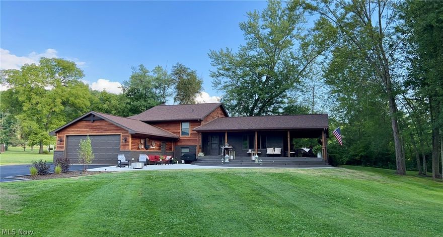 BEAUTIFUL SUNSETS ON THE WATERFRONT. This home features easy access to a newer handicap accessible double dock, flat lot, and all tucked in the corner of the woods for your peaceful hideaway. You won't find houses like this one on the waterfront. You can enjoy the views from the spacious patio, deck, or the wrap-around covered porch. This 2600 square foot bi-level, home is recently updated and features 3 bedrooms, 3 full bathrooms, 2 car attached garage, and an 10’x14’ shed on a concrete pad. The home offers 3 large bedrooms on the upper level that includes the master suite with its own separate office area and private deck.   It offers a large open concept kitchen/dining and living room on the main level and another large family room with a fireplace on lower level and a finished recreation/bedroom on the lowest level.  It has room for your family and friends to all enjoy the beauty of the 1500 acres of Atwood lake.   Call today for your private showing.