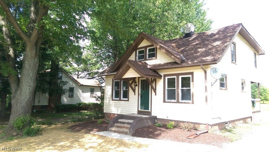 Why pay rent when you can own your own home that has been completely renovated inside and out. This 3 bedroom  Cape Cod sits on a full acre lot with area for firepit and features a loft, basement,brand new two car detached garage,  Ready to move in all stainless steel appliances, new carpeting, laminate floors, ceiling fans, AC, Enjoy a private view of your acre property from the sun room featuring 10 windows.  Upstairs loft area with two bedrooms and one bedroom on first floor.   Attractive price will prove to be less than rent and you own it!  Awesome low priced finances available and less than perfect credit we have solutions for you.  Call today before you miss out on a great opportunity.