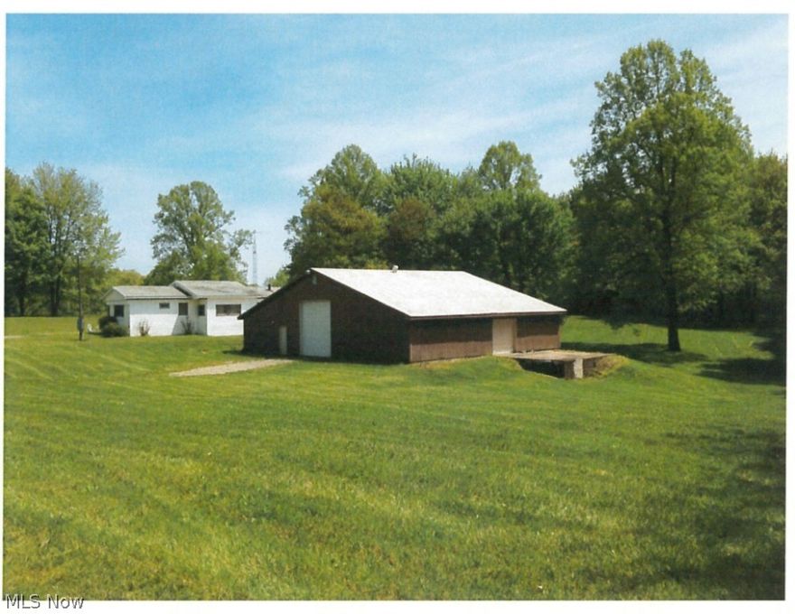 The property is located on 10 acres in Union Township in Tuscarawas County. The building is a 3,000 sqft well-insulated pole building with fuel efficient furnace along with hot and cold running water & a single half bath. There is a loading dock with an 8' foor and two 12' overhead doors, along with a man door.  All mineral rights the seller owns are included. There are also two storage buildings and one 3 bedroom, 2 bathroom residence on the property.