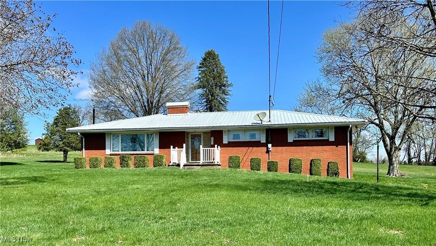 Come and experience this charming 3 bedroom, 3 bath home that has so much to offer! 3 bedrooms and 2 full baths on the main level, one guest and one master. There is another bathroom on the lower level, along with laundry and walk-out garage. Plenty of space for entertaining in the open kitchen/dining area, where you can enjoy the ambience and warmth of the wood burning fireplace. The living area has its own corner fireplace that can either be woodburning or gas. Situated on 3 well-manicured acres, this property has a 24x36 pole barn with full electric and exterior 30-amp RV receptacle with concrete pads to place your camper. Also has a second detached 24x28 garage that is heated, with water and electric. If you need storage for your recreational toys or other equipment, this is the place for you!