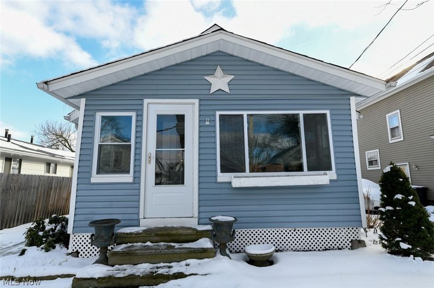 Sweet little bungalow with a charming enclosed porch and oversized detached garage is ready for you to call it home. Step inside to an adorable family room that leads to an immaculate kitchen offering butcher block counters and rustic, tin backsplash. The nice sized bedrooms have easy access to an updated bathroom.  Upstairs has endless possibilities and could be used as a master suite, playroom or additional living area.  The bright, clean and dry basement offers storage space that could be easily converted to a man cave, home theater or craft room. Outside the yard is partially fenced giving you peace of mind for a safe zone for your children or pets.  Schedule a time to see this soon, we know you will love it!