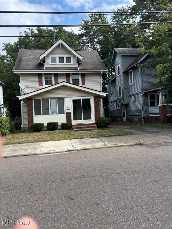Welcome to 577 Rhodes Avenue, This 3 Bedroom Colonial with full Atic is located in the Hearey of Akron. This large 3 Bedroom features a Large Living, Dining Room, Kitchen and half Bath. The upstairs features 3 Large Brdrooms and Bathroom with Large finished Attic. The Exterior features Enclosed Porch, Viny Siding, updated Windows and Detached Garage, This revitalization neighborhood has new built houses popping up all over this neighborhood. This property is minutes away from Lebron James Museum, Downtown Akron and The University of akron. Call for your private shpwing toda!!!!!