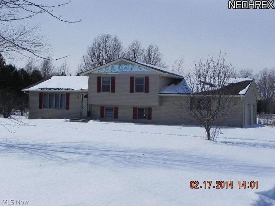 Investor's delight!  This home is cash or rehab loan ONLY. No plumbing and unsure if furnace is operational. Spacious 3 bedroom split on 2.3 acres just waiting on your finishing touches!  Offering geothermal heating and a very nice layout, it will just bring a bit of imagination and elbow grease to have this back to it's full potential!  The formal living room offers many options..the formal dining room has new hardwood floors and a sliding glass door w/ deck overlooking the back acreage!  The kitchen offers an abundance of cabinetry and overlooks the lower level family room w/ fireplace.  Upstairs are the 3 bedrooms...master suite w/ private bath and another full guest bath.  A partial basement and an additional unfinished room off the attached 2 garage allow for many possibilities.  Outside, most of the backyard is fenced and there is a oversized barn too!