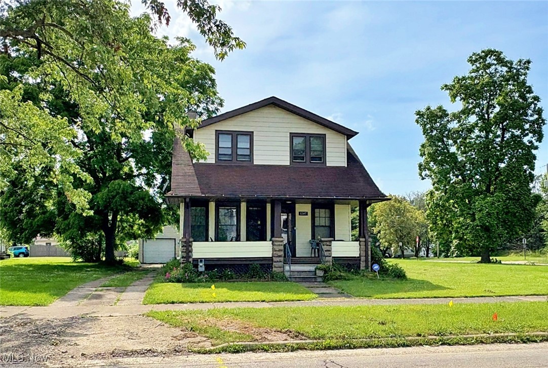 Located in Elyria, this charming two-story home sits on over half an acre spread across four separate parcels, offering plenty of room to build or expand. The home features 3 bedrooms and 1.5 bathrooms, with a full basement that can be finished to add even more living space. A spacious detached building provides flexible use as a garage, workshop, or extra storage. Enjoy relaxing on the large front porch, perfect for morning coffee or evening gatherings. The generous lot size offers endless possibilities for outdoor living, gardening, or future development. This unique property combines space, potential, and convenience in a quiet residential setting.