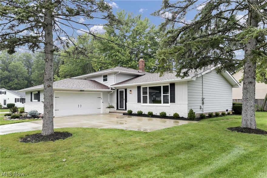 Welcome home to this beautifully renovated 4 bedroom 2 bath home in Westlake! No expense has been spared with the upgrades, virtually everything is brand new! The exterior has been freshly painted, including all new windows, new furnace & A/C, landscaping & lighting throughout the entire home. Step inside to a large living room with vaulted ceilings, rustic beams & brand-new luxury vinyl flooring. The kitchen is a chef's dream with white shaker style cabinets featuring soft close drawers & doors, stainless steel appliances, modern backsplash & quartz countertops. The lower level family room has a cozy fireplace with sliding doors out to a patio, a bedroom, & renovated full bath & a sizable laundry room. The basement has a rec room & office/flex space. Upstairs you will find 3 bedrooms with new carpet & a full bath that has been updated with new tub, tile & vanity. Close to schools, shopping, I-480 & the airport. The roof is only 3-5 years old, so there is nothing to but move right in!