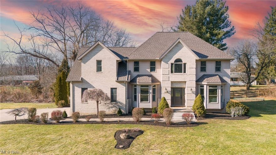 Incredible, Timeless, Majestic are just a few words to describe this 5 bedroom 5 bathroom Colonial in Copley Fairlawn Schools. Sitting on a picturesque 1.3 acre lot, featuring your own pond this home has been meticulously updated and renovated. . Welcome your guest in to the 2 story entrance with pristine hardwoods, grand staircase, and  large windows and updated lighting. Formal living and dining rooms flank the one side of the home. A 5th bedroom with attached bathroom, currently staged as an office, is the perfect layout giving you real flexibility. You will be so proud to entertain in this completely new custom kitchen with all new soft close cupboards, high end quartz counters and top of the line matte stainless appliances. Seamlessly open to the large family room, anchored by vaulted ceilings and a beautiful fireplace with direct access to the new large deck. You can access the upstairs 4 bedrooms from one of 2 staircases. Each bedroom has its own bathroom. The star of these bedrooms is the master suite. Tray ceiling, his and her walk in closets and a bathroom straight out of a magazine. Custom shower with rain head and body spray and a elegant stand alone tub. 2nd story laundry will make this chore very convenient and private. The large walkout basement has another full bathroom and is already pre wired and plumbed for a kitchen. So many updates will give you peace of mind. NEW Roof, New HWT, 1 NEW Furnace all new outlets and switches. A new custom deck with built in storage benches. Some of the windows have been replaced. All others and good Pella windows. There are 2 furnaces and 2 Ac (s) great for efficiency and enjoyment. The outside is a great place to enjoy and entertain. The deck lands onto a stamped concrete patio and the spacious yard and stocked pond will be a great space for many years.