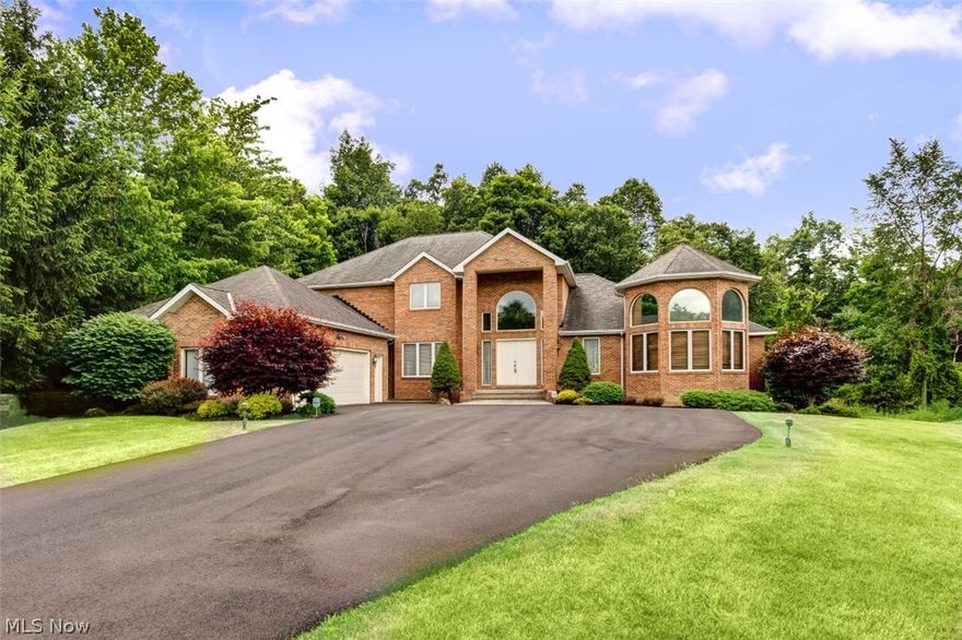 Great opportunity to own a solid BRICK home with a 1st floor Master Suite in Gates Mills! Recently painted to a neutral tone completed this moved in ready home! Brand new driveway leads you to the home set back from the street. Covered front porch enters into cultured marble foyer. Open floor plan is great for entertaining! Spacious eat-in kitchen features a large island and all appliances! Private 1st floor laundry room is located off the mud room from the garage entrance. Covered porch and deck are accessible right from the kitchen. 2 story great room with large windows to bring in natural light. Dining room is open to the living room. Private 4th bedroom could also be a home office! Master includes walk-in closets, whirlpool tub & walk-in shower! Two half baths complete the 1st floor. "Catwalk" hallway upstairs leads to 2 more bedrooms each with their own bathrooms! Basement is plumbed for a full bath and left untouched to complete your dream entertaining space or leave it untouched