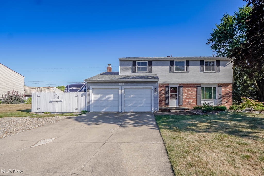 Set on an over half acre corner lot in Green Schools, 1659 King Drive offers plenty of space inside and out! The main level features a formal living room and dining room with crown molding, plus a kitchen with plenty of cabinet and counter space, stainless appliances, tile backsplash, and a casual dining area. It opens to the family room with a gas log fireplace and French doors that lead to a covered patio and level backyard, ideal for outdoor gatherings. A half bath rounds out the main floor.
Upstairs, you’ll find four bedrooms and two full baths, including the primary suite with a double closet and private bath with a double-sink vanity. The finished lower level adds even more living space with a rec room for movies, games, or hobbies.
Extras include a heated two-car attached garage with Nature Stone flooring, extended driveway for additional parking, and a backyard shed with electric. Recent improvements include a newer roof, siding, windows, furnace, A/C, and 200 amp electric panel. Conveniently located near shopping, dining, and highway access—schedule your showing today!