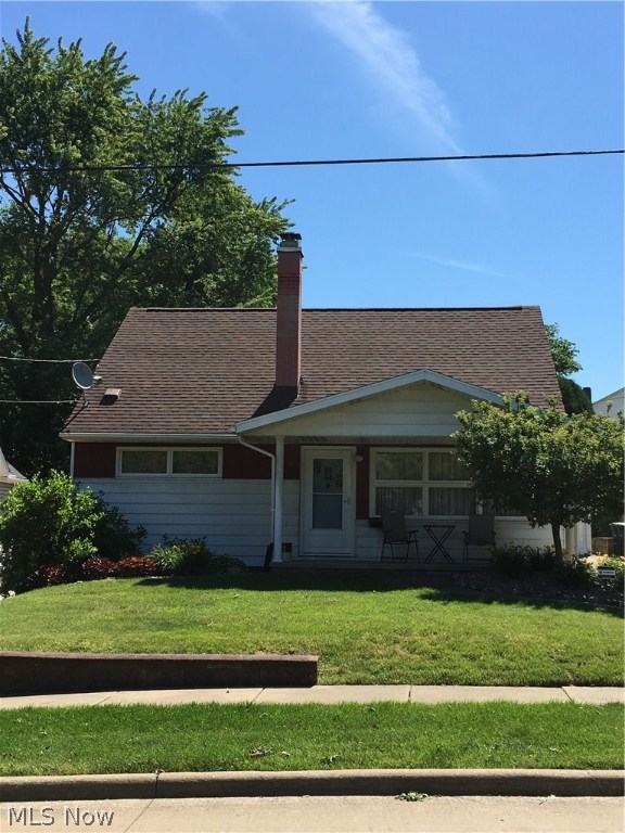 This well-cared-for family home offers 3 bedrooms, 2 full baths, very nice finished recreation room with working gas-start fireplace (wood burner option) and built-ins, completely fenced in backyard and large screened-in covered back porch. If easy-care kitchen/dining room flooring, freshly painted neutral décor, nice size closets, good storage areas, 2014 central air, new storm door, 100 amp electrical box, insulated attic, relaxing front porch, concrete drive, city utilities interest you, call to see today! Appliances include refrigerator, stove, microwave, dishwasher, washer and dryer. You will appreciate it's cleanliness throughout and pride of ownership through the years. Nicely landscaped with perennials. Hardwood floors throughout both main floors under new carpeting. Enjoyable for everyday living and family entertainment no matter the weather. Great value with this affordable, solid investment. Immediate possession offered. Around the corner is Windemere Elementary and