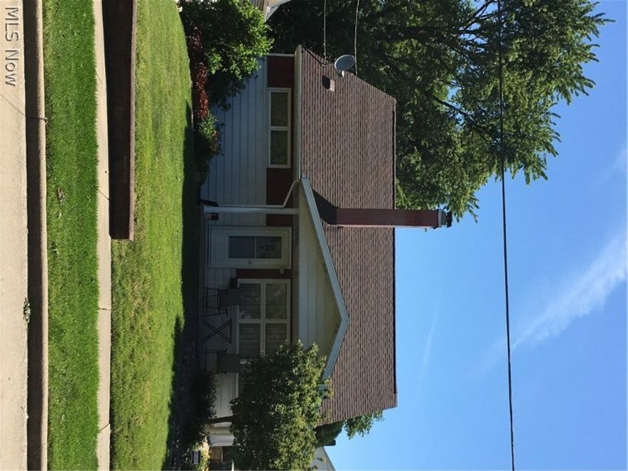 This well-cared-for family home offers 3 bedrooms, 2 full baths, very nice finished recreation room with working gas-start fireplace (wood burner option) and built-ins, completely fenced in backyard and large screened-in covered back porch.  If easy-care kitchen/dining room flooring, freshly painted neutral décor, nice size closets, good storage areas, 2014 central air, new storm door, 100 amp electrical box, insulated attic, relaxing front porch, concrete drive, city utilities interest you, call to see today!  Appliances include refrigerator, stove, microwave, dishwasher, washer and dryer.  You will appreciate it's cleanliness throughout and pride of ownership through the years.  Nicely landscaped with perennials.  Hardwood floors throughout both main floors under new carpeting.  Enjoyable for everyday living and family entertainment no matter the weather.  Great value with this affordable, solid investment. Immediate possession offered.  Around the corner is Windemere Elementary and