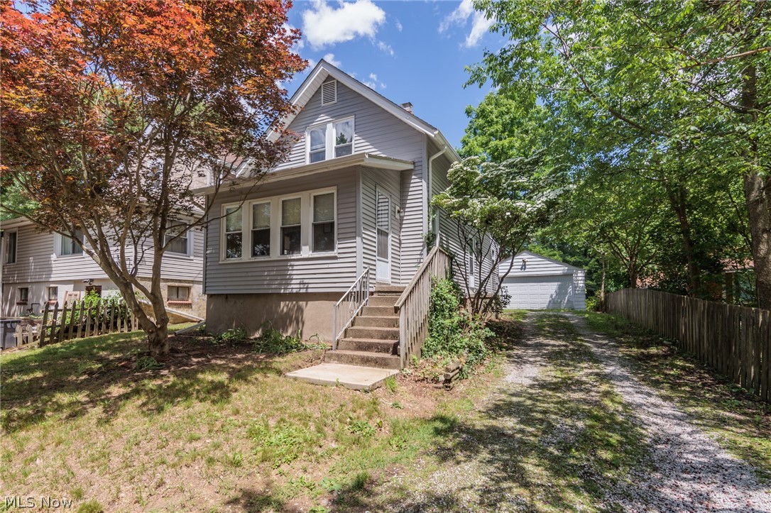Welcome to 6472 Church Street in Kent School District! Close to the Portage Hike and Bike Trail and Towners Woods, and just a short walk to Brady Lake or a quick drive to downtown Kent or Ravenna, this charming home is perfectly situated on a quiet dead-end road. Enjoy cottage-style living with a private double lot, featuring a fire pit, a huge two-car garage, and a full basement. Inside you will find a first-floor laundry room, eat-in-kitchen, dining and living rooms, and a beautiful sunroom. On the second level there are 2 bedrooms and a full bath with a skylight. The lower level has a potential third bedroom and plenty of room for storage.