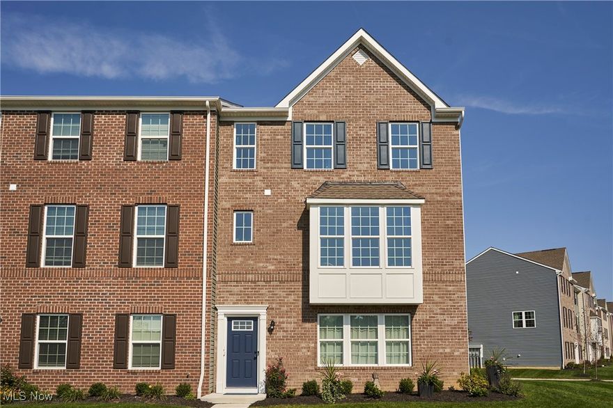 Wonderful townhouse with a Pond and Sunset views! Beautiful white finishes feature a luxury kitchen with SS appliances, quartz countertops, a ten foot island, with white 42" cabinets. The kitchen is open to the large Great Room, so whatever your needs, you'll have space for everyone! The owner's suite has a large, walk-in closet, double vanity and TILED ROMAN SHOWER. Two additional bedrooms, a 2nd full bath and laundry area complete the 2nd floor. You won't have to do any stairs to do your laundry! There also is a bonus room that overlooks the pond with water fountain, plus the restful sunsets. The bonus room is freshly painted with LVT flooring. What else would you want!! This home is located minutes from biking and hiking trails and Cuyahoga National Park.  Grass cutting and snow removal is done for you at the Villages at Sycamore in Cuyahoga Falls.