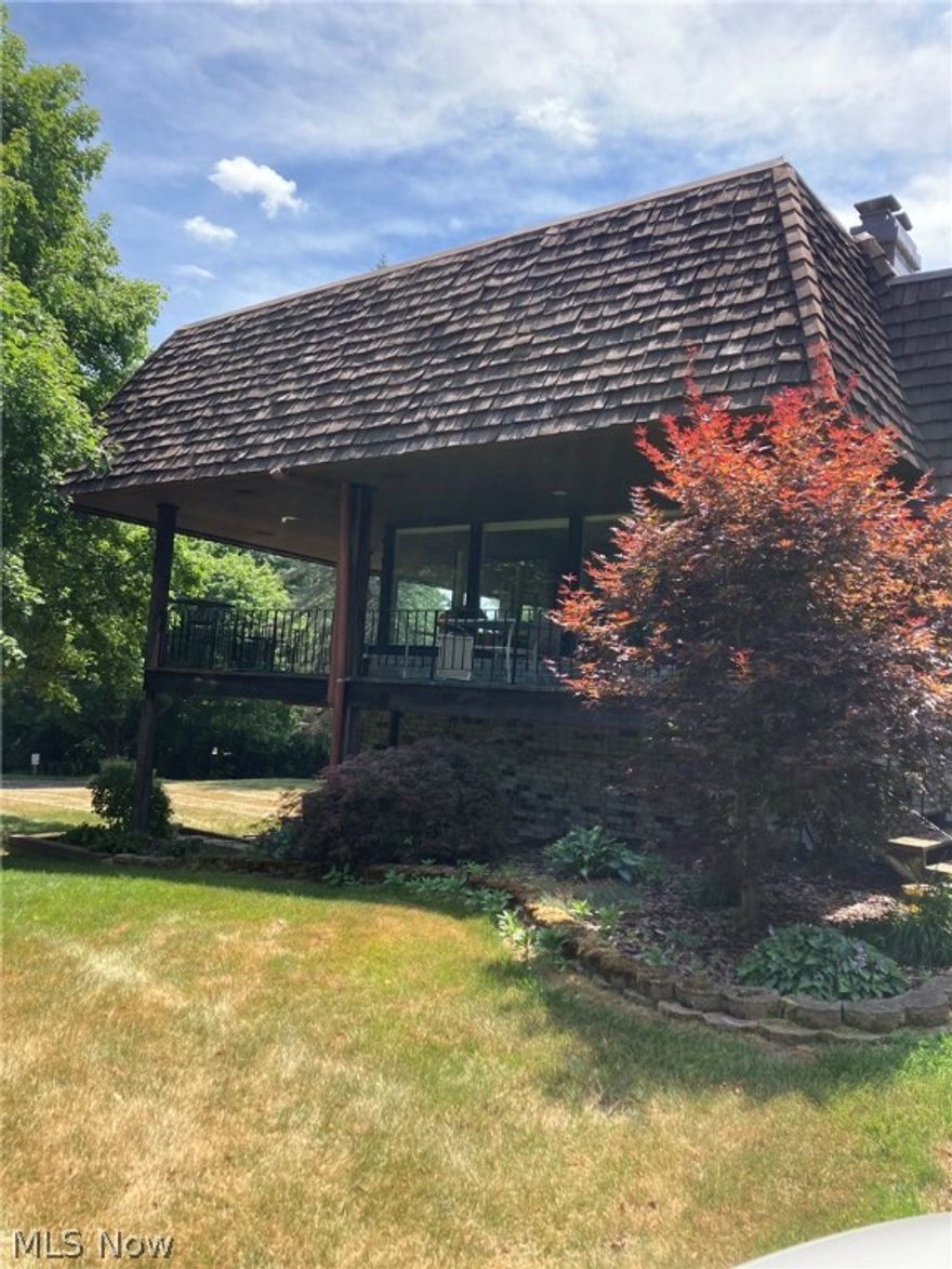 Open-concept living in a stunning park-like setting! Three big bedrooms and three full baths, with generous wrap-around decks. Large windows for amazing views and extraordinary natural light. Laundry room on main floor; all appliances stay.  The ample living/dining space features a cozy fireplace for the winter months. Enjoy the clubhouse, the lake, the tennis courts, the country life- but still close to Medina and Akron, and easy access to highways.