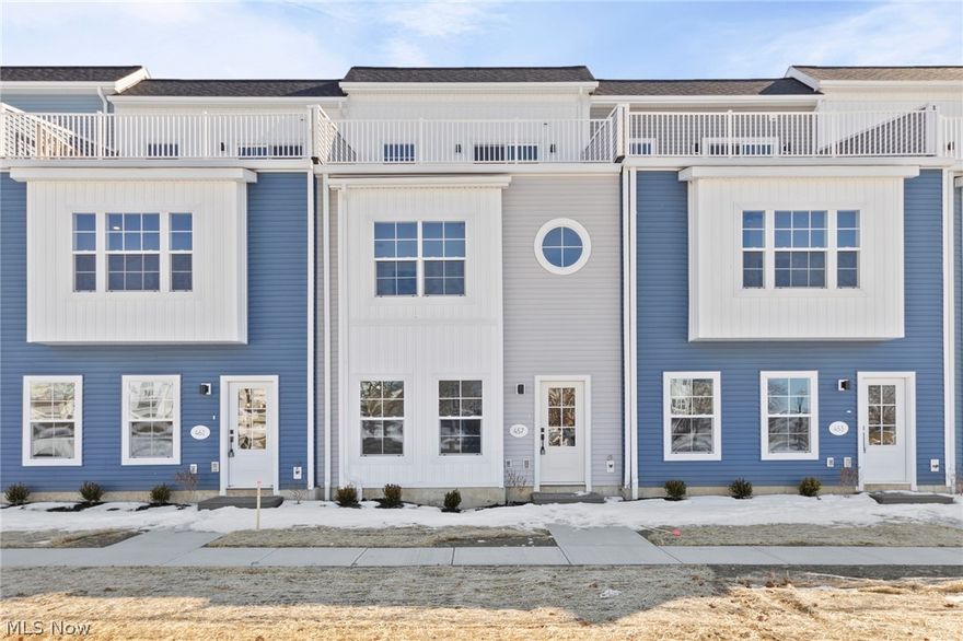 Welcome to Harborwalk. Lorain's Premier Waterfront Community! This brand-new, never-lived-in townhome offers 3 bedrooms, 2 full bathrooms, and 2 half bathrooms. The bright, open-concept main level features durable vinyl flooring throughout and a modern kitchen with quartz countertops, microwave, and dishwasher, all flowing seamlessly into the spacious living and dining areas filled with natural light. Upstairs, the primary suite includes a generous ensuite with a walk-in shower. Two additional bedrooms and a full three-piece bath complete the second level. Continue to the third floor to find a bonus living area with a wet bar, an ideal spot for entertaining or unwinding. Step out onto your private third-floor deck overlooking the river, offering front-row views of summer concerts and year-round events at Black River Landing. All of this is just steps from the Black River, Spitzer and Alliance Marinas, Lake Erie's scenic mile-long pier, and the vibrant Broadway District with restaurants, coffee shops, and the popular Lorain Brewing Company. The community includes a pool and fitness center.  The recently remodeled party center can also be rented for a fee. Waterfront living at its finest! Don't miss this incredible opportunity!