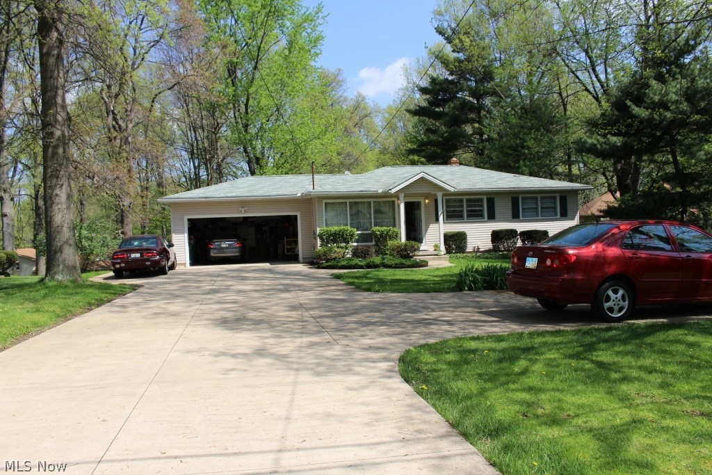 Many updates on this meticulously maintained ranch home in Stow.
Hardwood through out first floor except kithcen and dinning room. 3 bedrooms and 1 full bath with marble Jacuzzi bath tub and Laundry chute on first floor and 1 bonus room, 1 full bath and a large family room with fireplace on lower level. Corian kitchen countertops, stainless steel microwave, range, dishwasher and refrig erate , garbage disposal. Bottom cabinets have newer pullout shelves and 2 pullout garbage buckets, plenty closets and storage space. Newer furnace, humidifier and newer roof, siding, flooring,concrete driveway and 2 extra packing spaces beside attached oversized 2 car garage (expanded in the rear). Bright sunroom, spacious deck over looking a yard of 0.72 acres.
All of these locate at the highest spot of the street. Close to schools, parks, and even restaurants. A must see, don’t miss this one!