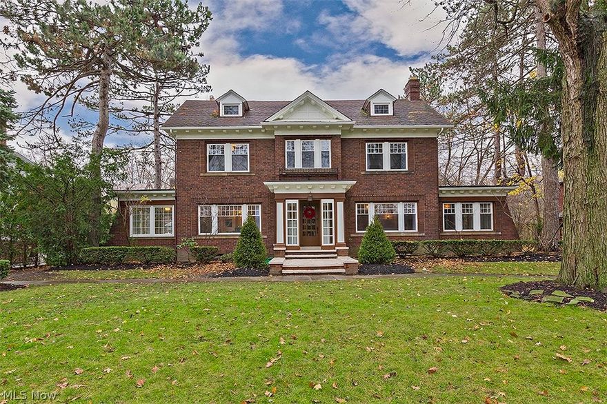 Beautifully restored to its original magnificence, this all-brick colonial is completely renovated with luxury finishes and an optimal floorplan. Sophisticated colors, rich hardwood floors, and graceful fixtures create a timeless and inviting atmosphere, starting with the formal living room with a fireplace and French doors. From there, walk into the family room opening up to a dinette area, great for casual dinners. Step down to a bonus room, offering a flexible area to make it truly your own. With garage and outdoor access, it could serve as a great space for your kids, or a lovely sunlit sitting area. The open kitchen is absolutely stunning showcasing stainless steel Fisher Paykel DCS appliances, a wine cooler, gorgeous granite countertops, and a center island. Off the dining room is a three season sun room, great for enjoying the warmer Cleveland weather. The original staircase leads you to the master suite featuring a walk-in closet with built-ins, gorgeous bathroom with glamour b
