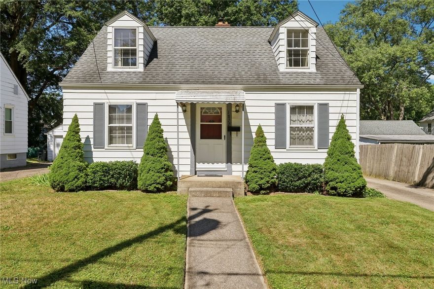 This Cuyahoga Falls Cape Cod is an affordable little gem! As a first-time homebuyer, or real estate investor, you will appreciate how meticulously this home has been cared for. On the first floor, you'll see rich hardwood floors flowing through the living area and two spacious first-floor bedrooms. The original floors are in such great condition, they look as though they could have been installed yesterday. The full bathroom has been remodeled and features a walk-in shower with sliding glass doors. The eat-in kitchen is in pristine condition and holds the original charm of the home. Outside, there is a sturdy 1 car detached garage with an electric opener. This cutie is located right in the center of it all, minutes away from Portage Crossing, the new Cuyahoga Falls school campus, and downtown, making it an excellent location for a new homeowner, or great income potential for an investment property.