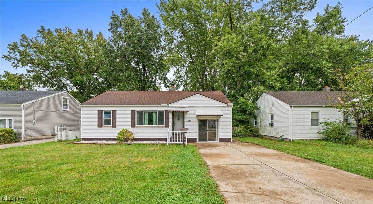 Discover this charming, move-in ready, three-bedroom bungalow offering the ease and convenience of first-floor living. Step into the bright and airy living room, filled with natural light from a large front window, seamlessly flowing into a cozy family room with sliding doors that open to the front of the home. The well-appointed kitchen features ample cabinets, granite counters, appliances included, and another set of sliding doors leading to a serene rear patio. Adjacent to the kitchen is a convenient laundry room for easy first-floor living. The main level boasts two spacious bedrooms with hardwood floors and a full bath complete with a walk-in shower. Upstairs, you'll find a large third bedroom with a lofted ceiling, perfect for additional living space or a private retreat. Step outside to enjoy the peaceful covered patio, ideal for outdoor dining or entertaining, and a fully fenced-in backyard complete with a shed for all your gardening tools. Located in a prime area, you're just minutes from Chagrin River Park, dining, and shopping. Recent updates include new kitchen countertop, faucet and sink, new sliding door in front room 2023, new sliding door in kitchen 2019, all appliances are less than 6 years old. This home offers a perfect blend of charm, functionality, and location. This home is City of Eastlake POS compliant.