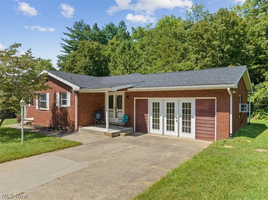 Beautifully Updated Brick Ranch on an almost Acre Wooded Lot, at the End of a dead End Street in South Parkersburg. This Home offers 3 possibly 4 Bedrooms, 2 1/2 Baths, Office, LR, FR, & a Large Recroom in the basement. The Eat In Kitchen has New Solid Wood Cabinets, Counters, SS Appliances & a New Bar area for stools plus plenty of space for a nice size DR table. New Roof, New Bathrooms, New Solid 6 Panel Doors, New Flooring & Trim. The LR on the main level & the Recroom in the basement both have Fireplaces for your enjoyment. The Lovely Tree Lined Lot has plenty of room for everyone to enjoy & off of the backyard is a Quaint Wooden Bridge crossing over to your Private Patio Snuggled in the Trees, what could be more relaxing. You will also notice a Storage Shed & the Oversized 2 Stall Detached Garage w/ plenty of workspace. The feel of being out all while being in town.  ***Sellers would consider paying up to $3,000 for basement flooring/buyers closing costs.***