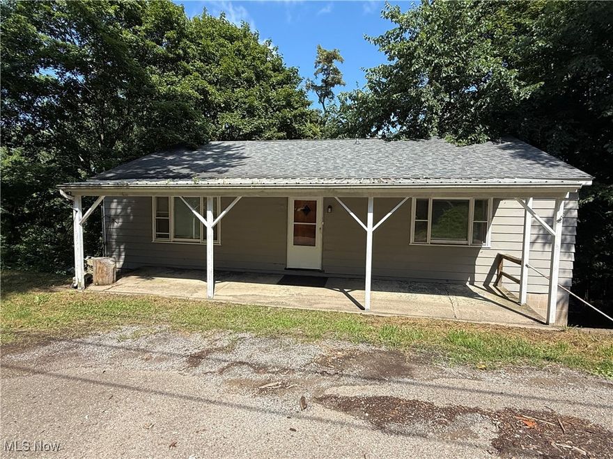 Charming ranch home, Tucktaway in close to all amenities. This home welcomes you with a covered front porch that leads into a cozy foyer this home features very large rooms, including a large eat in kitchen with oak cabinetry off. The kitchen is first floor laundry. There are two large bedrooms on the first floor, along with a full bathroom and living room. Downstairs is a large basement with garage featuring high ceilings.