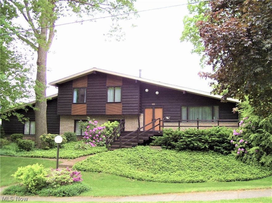 One owner, quality built, cedar and stone home on 2 1/2  wooded city lots. 16 x 32 Inground lazy L pool with fenced rear yard. In addition to the 2 car attached garage there is a detached 2 car garage with storage loft. Numerous landscape plantings. Wrap around front deck. Oak hardwood floors under all carpets except first level.  Freestanding circular glass wood burning stove in family room. 3 skylights bring additional light into the vaulted living room and main upstairs bath. Anderson windows with storms. Pella windows on rear addition.  Pull out shelves in kitchen pantry cabinet. 16" x 16 " porcelain tile in kitchen and bonus room. Bonus room has a cathedral ceiling. 2 laundry areas.  Lots of storage shelving in garage and basement plus easy access to 3 attics.