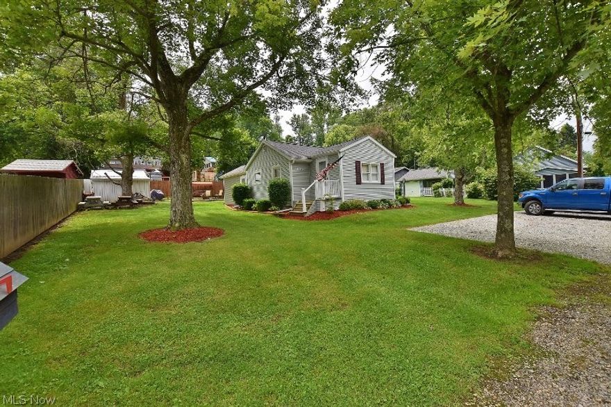 Completely updated turn key vacation cottage at Atwood Lake on 2 private lots (NO LEASE) in the Sunset Valley community. The cottage has been completely updated and ready for your enjoyment. 2 dock slips are located just a short walk away and a 24' pontoon boat and motor can be purchased separately if desired. You will love the spacious covered patio with ceiling fans to enjoy the great outdoors at Atwood Lake. A new forced air natural gas furnace along with central air conditioning is being installed  offering the new owners year round comfort and peace of mind. You will love the new knotty pine family room with 2 walls of windows and a gas fireplace. In addition is a living room (unfurnished) that has a second gas fireplace. A newly added utility room with exposed metal ceilings is charming and also serves as a mud room. So you can immediately enjoy your new lake home, the kitchen ware, bath and bed linens will also remain. Two sheds offer storage. The matching patio furniture under