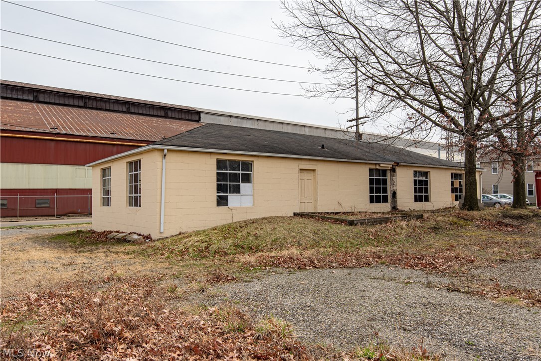 The property is zoned industrial and located across from the Timken Company on Harrison Ave SW. The building is block construction. The shop area is 26’x42’ with three garage doors. The office area is 26’x26’ that can be converted to a shop area, total sq. ft. 1768. The building has two separate bathrooms; office area has full bathroom and the shop area has a 1/2 bath. Three phase electric is run to the building. Building has a 200 amp single phase new electrical box. New 135,000 btu overhead heater installed March 2021. Large back lot accessible by city alleyway, great for a lay-down yard.