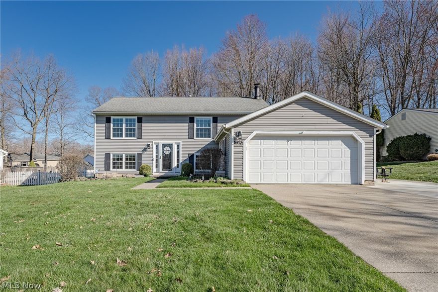 Move right into this charming bi-level home on a quiet cul-de-sac street in Twinsburg! This delightful home features over 1900 square feet of living space with 4 bedrooms, 2 full bathrooms, spacious open living areas, a fantastic back yard with a pool, and more! The front door opens into a welcoming foyer with the main living area right upstairs. Here you will find a very spacious, sun-filled living area that is open to a formal dining room with a sliding door to the back deck. The adjacent kitchen includes a full complement of appliances, a lovely tile backsplash, and ceramic tile flooring. Down the hallway are three generously-sized bedrooms as well as a full bathroom. The lower level features a very spacious family room with a brick fireplace and a bar, a laundry / utility room, a second full bath, and a fourth bedroom that is currently setup as an office. You will love the fully fenced-in back yard that includes an aboveground pool, a covered hot tub, a deck, and a shed. Conveniently located just blocks away from Tinkers Woods Park, shops, and highway access. Don't miss this one - it will go fast!