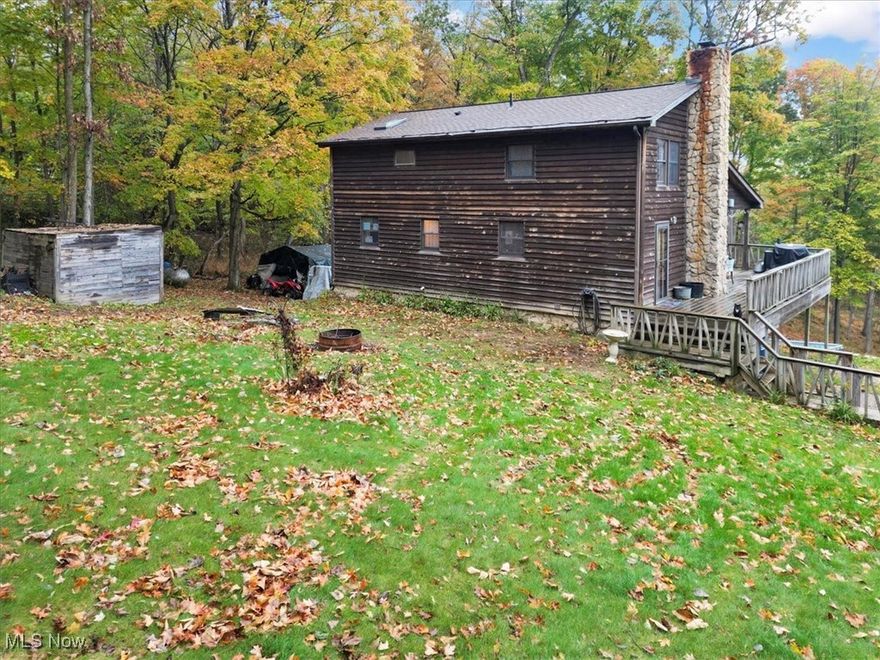 **MOTIVATED**Don't miss this rustic Cape Cod home nestled on 10.01 wooded acres! Step into the great room with a wood-burner fireplace, a fully applianced kitchen featuring Amish-crafted custom cabinets. The home offers 3 bedrooms, 2.5 baths, with a loft.  Stunning knotty pine ceilings with 3 skylights that flood the space with natural light. Solid 10-panel wood doors add to the rustic charm. The walk-out basement leads to a 2-car attached garage.  You can relax on the partially covered wraparound deck while taking in the serene wooded views.  Above ground 32x16x52 swimming pool conveys.  Seller is offering flooring allowance at closing.