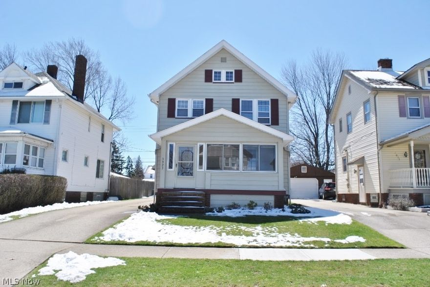 Welcome home to this amazing 3 bedrm, steel sided Colonial w/2.5 car garage. Upgrades that include newer furnace, hot water tank, garage roof, garage doors, fenced yard, remodeled bath, newer kitchen floor, freshly painted exterior & interior, hardwood floors, glass block windows, decorative fireplace, ceiling fans, appliances including oven, countertop range,dishwasher, garbage disposal, washer & dryer. Enclosed front porch offers extra space for 3-season use. Convenient access to major freeways, shopping & Metro Parks. Charming!!! Great location.
