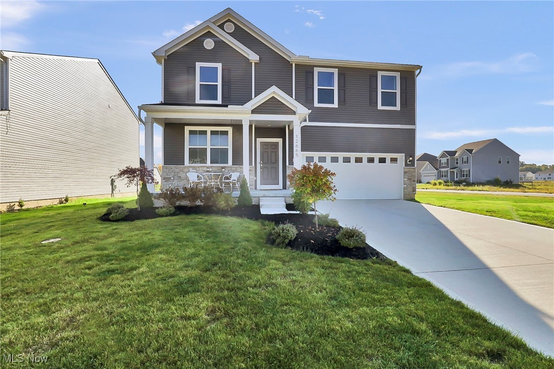 No need to wait for a new build...move right in! This beautifully upgraded 4-bedroom, 3-bathroom home with over 2,700 sq. ft. in the highly sought-after Emerald Woods community is ready today! This modern craftsman blends elegance, function, and professional design throughout.
Step inside to a gourmet kitchen featuring Calacatta Malang quartz countertops, farmhouse sink, gold Moen faucet, knurled brass hardware, and a full-height porcelain backsplash. A custom coffee bar with butcher block countertop, floating shelves, and a tiled wall creates a perfect morning retreat.
Designer upgrades are showcased in the lighting, window treatments, flooring, powder room wallpaper & molding, and bathroom hardware. The gathering room extension with fireplace provides a warm and inviting space for everyday living and entertaining.
The primary suite is a true retreat, complete with upgraded cabinetry and fixtures. Outside, enjoy professionally installed landscaping and a lush lawn.
Additional highlights include smart-home wiring, added windows for abundant natural light, and negotiable furniture for those seeking a turnkey, fully styled home.
Every detail has been thoughtfully curated—this is more than a home, it’s a complete lifestyle upgrade that seamlessly blends luxury, function, and design. Schedule your private showing today!
