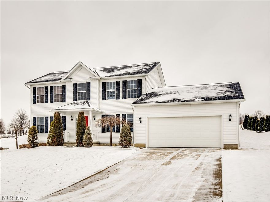 What a great find in Lake Local Schools! This stunning colonial home, located in this Highlands neighborhood, is loaded with amenties!  Situated on nearly two private acres, in one of the top school districts in the county, this home offers 4 spacious bedrooms and 2.5 baths and a 2 car attached garage with a 9x10 storage area. The 11x13 foyer exudes warmth and charm, with lovely hardwood floors, while the enormous, 23x11 eat in kitchen features an 11x11 dinette, in addition to laminate floors, crown molding on upper cabinets, tiled backsplash, 2 lazy susans, solid surface countertops, stainless steel appliances and a pantry. The incredible 14x23 great room has a beautiful stone, gas fireplace with a hardwood mantel and plush carpet. The first floor laundry is 8x6 and has laminate floors. The second level features a large master suite, including a 12x15 bedroom, 9x11 full bath with double sinks, separate shower and soaking tub, while bedrooms 2, 3 & 4 all have either a walk in closet or