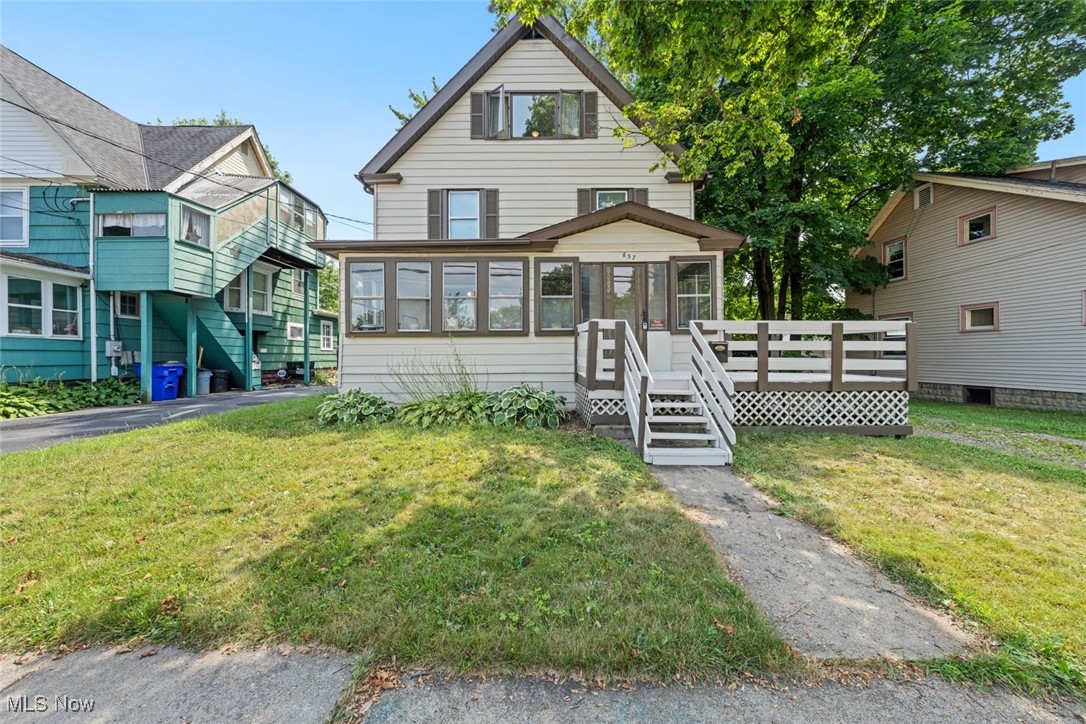 Welcome home to this large 4 bedroom colonial with 2 full bathrooms, 1 half bath and laundry on the 2nd floor! Unusual for it's age there is a half bath on the main floor. Wood burning fireplace in the living room with decorative stone mantle. Updated kitchen and baths with ceramic tile and newer vanities. The third floor has 2 full bedrooms with full bath. Screened in front porch. Large yard with mature trees and plenty of room to grow! Goes back to the fence behind of the neighbors. Kitchen appliances included, just move in!