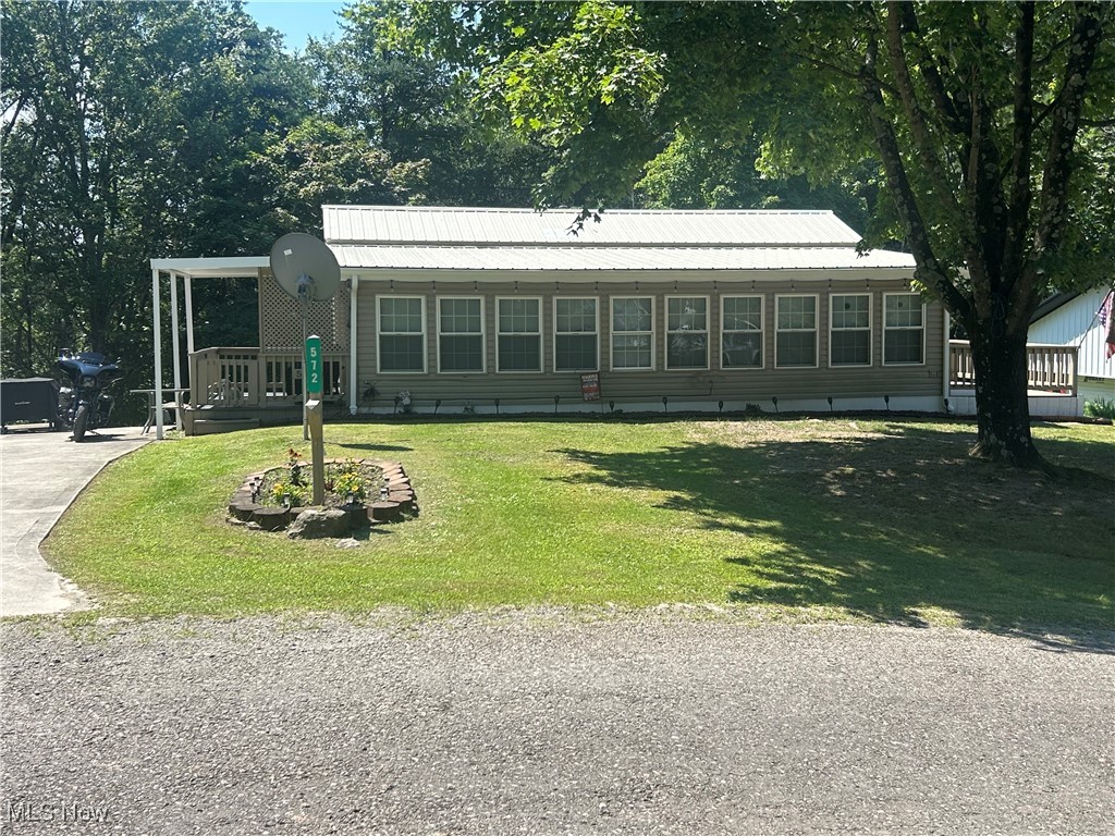 Located in a gated community near Seneca Lake, this updated property includes two private lots and offers an open floor plan with an additional family room for extra living space. The home features one full bath and a large backyard, ideal for outdoor enjoyment. A private shed provides convenient storage for your golf cart. Community amenities include a swimming pool, organized children's activities, and secure access-all just 2 minutes from beautiful Seneca Lake. Perfect for a seasonal getaway or year-round living.