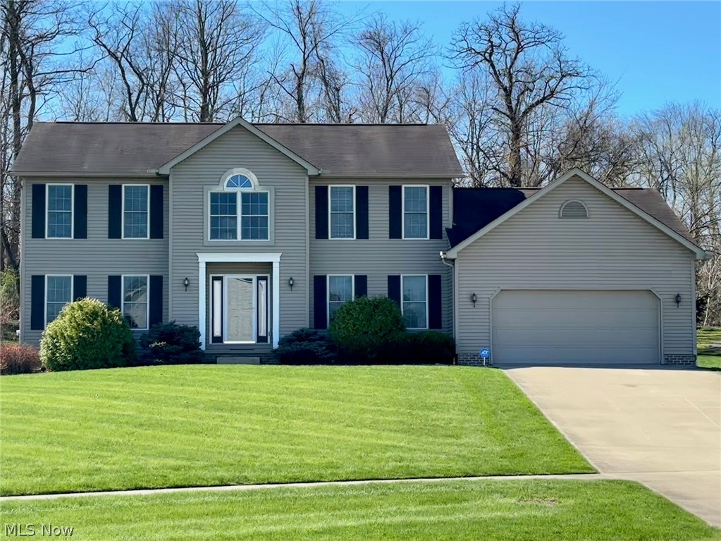 Located in the sought after River Bend neighborhood, this fantastic 3-bedroom, 3.5 bath colonial boasts an inviting floor plan. Entering through the 2-story foyer, you are greeted by soaring ceilings, a bold staircase, and an abundance of natural light. In the heart of the home, a spacious living room features a gas fireplace and windows showcasing the tree lined backyard. The expansive eat-in kitchen features a center island with breakfast ledge, generous counter space, stainless steel appliances including gas stove & a pantry. Nearby, the formal dining room is perfect for additional entertaining space. A large versatile bedroom/study/library with a pocket door could be utilized as a formal living room or flex space! Rounding off the main floor, you will find a half bath, several closets, and main floor laundry. Heading upstairs, you will find two roomy bedrooms which share a full bath. Further down the hall sits the sizable primary suite! Attached, the primary ensuite has a large double vanity, garden tub, toilet closet, stand up shower, and walk-in closet. The finished lower level of this home offers a family room/rec area, full bath, & sizable storage areas. Outside, enjoy the quiet on a .43 acre lot which abuts trees, has a private patio, and is next to the Portage Hike & Bike Path access point. Don't miss this opportunity!