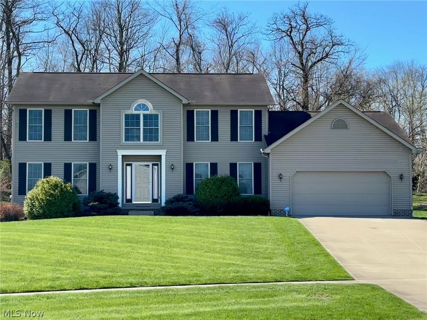 Located in the sought after River Bend neighborhood, this fantastic 3-bedroom, 3.5 bath colonial boasts an inviting floor plan. Entering through the 2-story foyer, you are greeted by soaring ceilings, a bold staircase, and an abundance of natural light. In the heart of the home, a spacious living room features a gas fireplace and windows showcasing the tree lined backyard. The expansive eat-in kitchen features a center island with breakfast ledge, generous counter space, stainless steel appliances including gas stove & a pantry. Nearby, the formal dining room is perfect for additional entertaining space. A large versatile bedroom/study/library with a pocket door could be utilized as a formal living room or flex space! Rounding off the main floor, you will find a half bath, several closets, and main floor laundry. Heading upstairs, you will find two roomy bedrooms which share a full bath.  Further down the hall sits the sizable primary suite! Attached, the primary ensuite has a large double vanity, garden tub, toilet closet, stand up shower, and walk-in closet. The finished lower level of this home offers a family room/rec area, full bath, & sizable storage areas. Outside, enjoy the quiet on a .43 acre lot which abuts trees, has a private patio, and is next to the Portage Hike & Bike Path access point. Don't miss this opportunity!