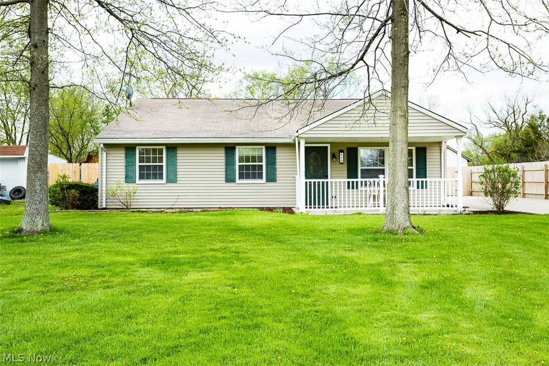 Beautiful ranch on almost an acre. This 3 bedroom, 2 full bath, 1,228 square foot ranch is move- in ready! Features a bright family room with laminate floors, immaculate kitchen with laminate floors and brand new in 2017 Samsung stainless steel appliances. , Separate laundry room has a brand new in 2017 Samsung washer and dryer. Master bedroom with master bathroom, and 2 other bedrooms with a main bath. Brand new carpet in all bedrooms. Two car garage with a workshop. Enjoy the outdoors with front porch and the enclosed back porch. Fenced in back yard only covers half the lot, the other half is not fenced in. 1 Year home warranty included. Schedule a private showing today before its gone!!!