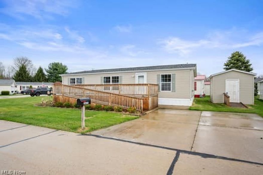 Welcome to this beautifully maintained 3-bedroom, 2-bathroom manufactured home situated on a lush corner lot. This inviting home features a stunning front deck, perfect for relaxing, enjoying the fresh air, and taking in breathtaking sunset views. Inside, the open floor plan creates a seamless flow between the spacious living room and dining area, making it ideal for both everyday living and entertaining. The kitchen offers ample cabinet and counter space, conveniently located just off the dining area.
The spacious primary suite serves as a private retreat, complete with a walk-in closet and a remodeled en-suite bathroom featuring a soaking tub, a separate shower, and a skylight. The thoughtful split-bedroom design places two additional generously sized bedrooms near the second full bath, offering both comfort and privacy. Additional highlights include a functional laundry room with a utility sink, fresh interior paint, and move-in-ready condition throughout. Outside, the property includes a charming 10x10 shed for extra storage, a concrete driveway, and a front patio area. There is also ample space to add a garage in the future if desired. Financing is available through Credit Human or 21st Mortgage. Do not miss the opportunity to make this well-cared-for home your own.